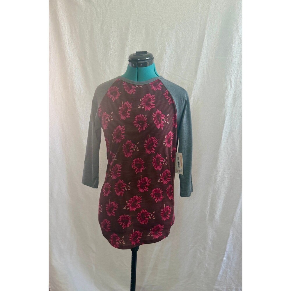 NWT Lularoe Randy top size extra small. Brand new with tags. Size XS.